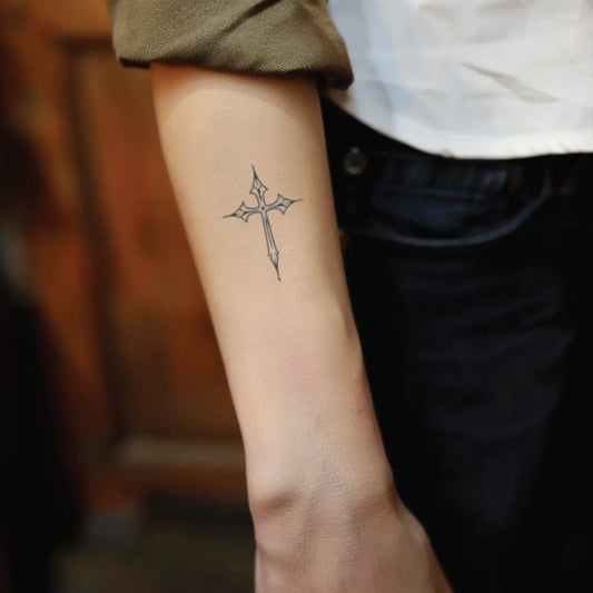 best cool simple small black grey color cross outline fake realistic temporary tattoo sticker design idea drawing for men and women on forearm lower arm