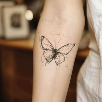 best cool simple small black grey color butterfly sketch fake realistic temporary tattoo sticker design idea drawing for men and women on forearm lower inner arm