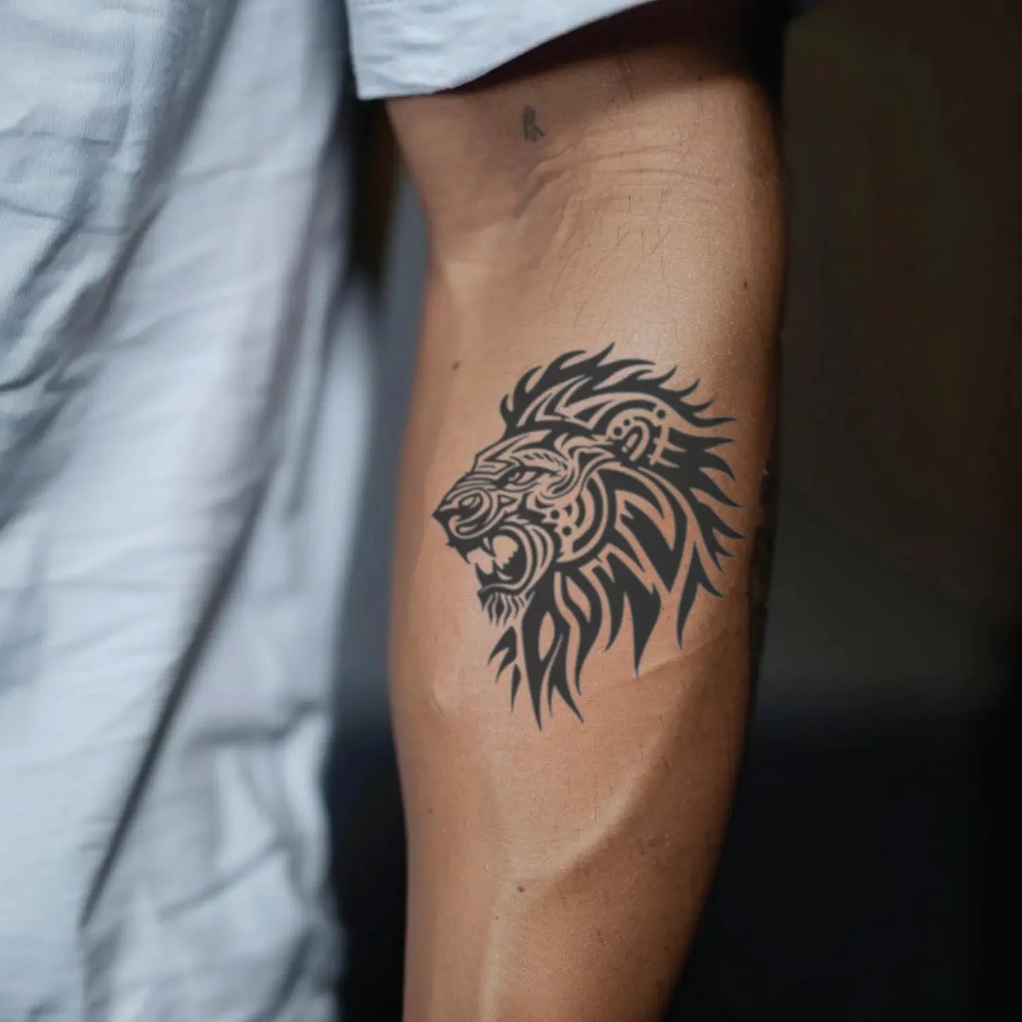 best cool simple small black grey color tribal lion fake realistic temporary tattoo sticker design idea drawing for men and women on forearm lower arm