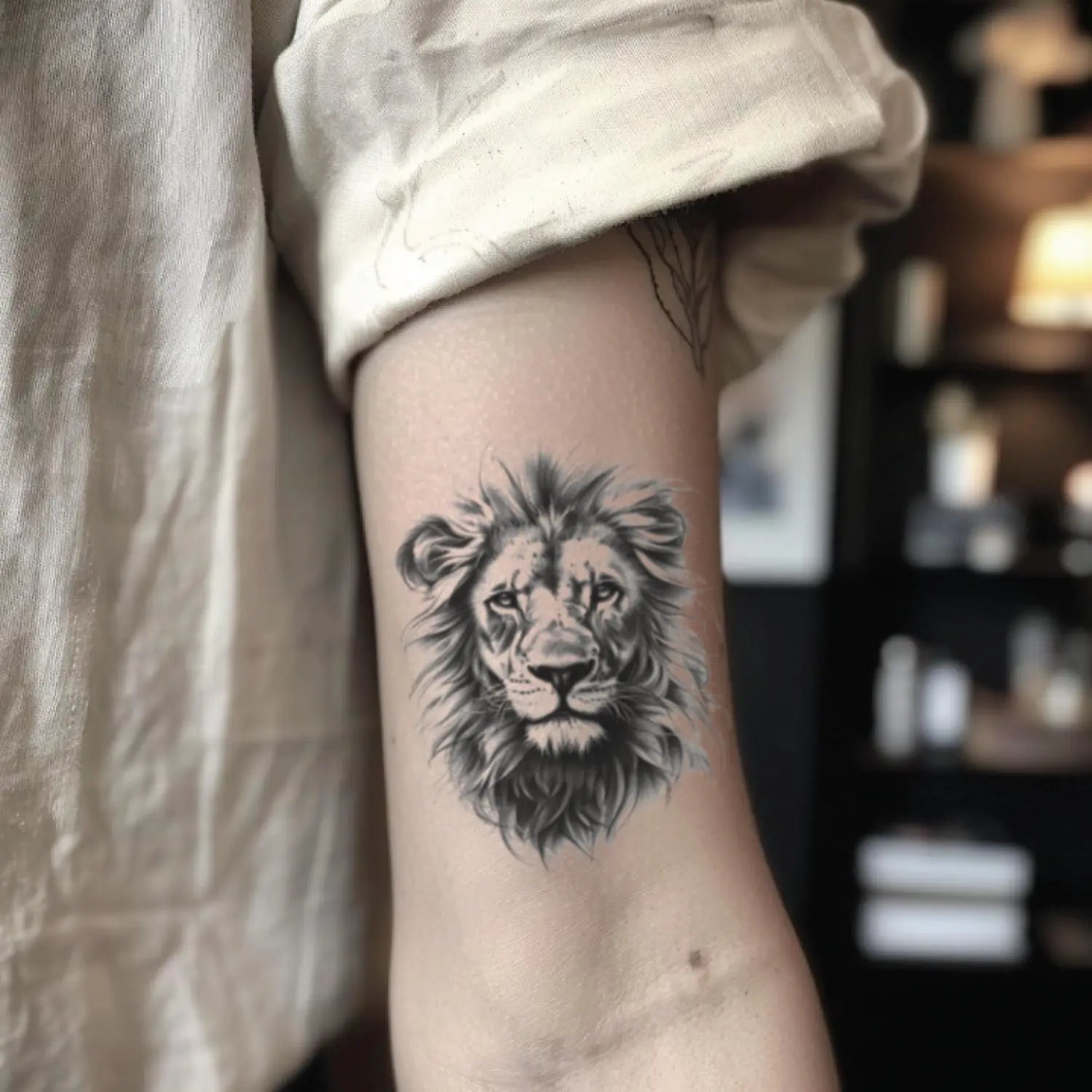 best cool simple small black grey color realistic lion fake realistic temporary tattoo sticker design idea drawing for men and women on bicep upper arm