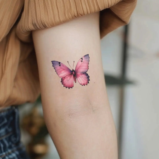 best cool simple small pink color butterfly fake realistic temporary tattoo sticker design idea drawing for men and women on bicep upper arm