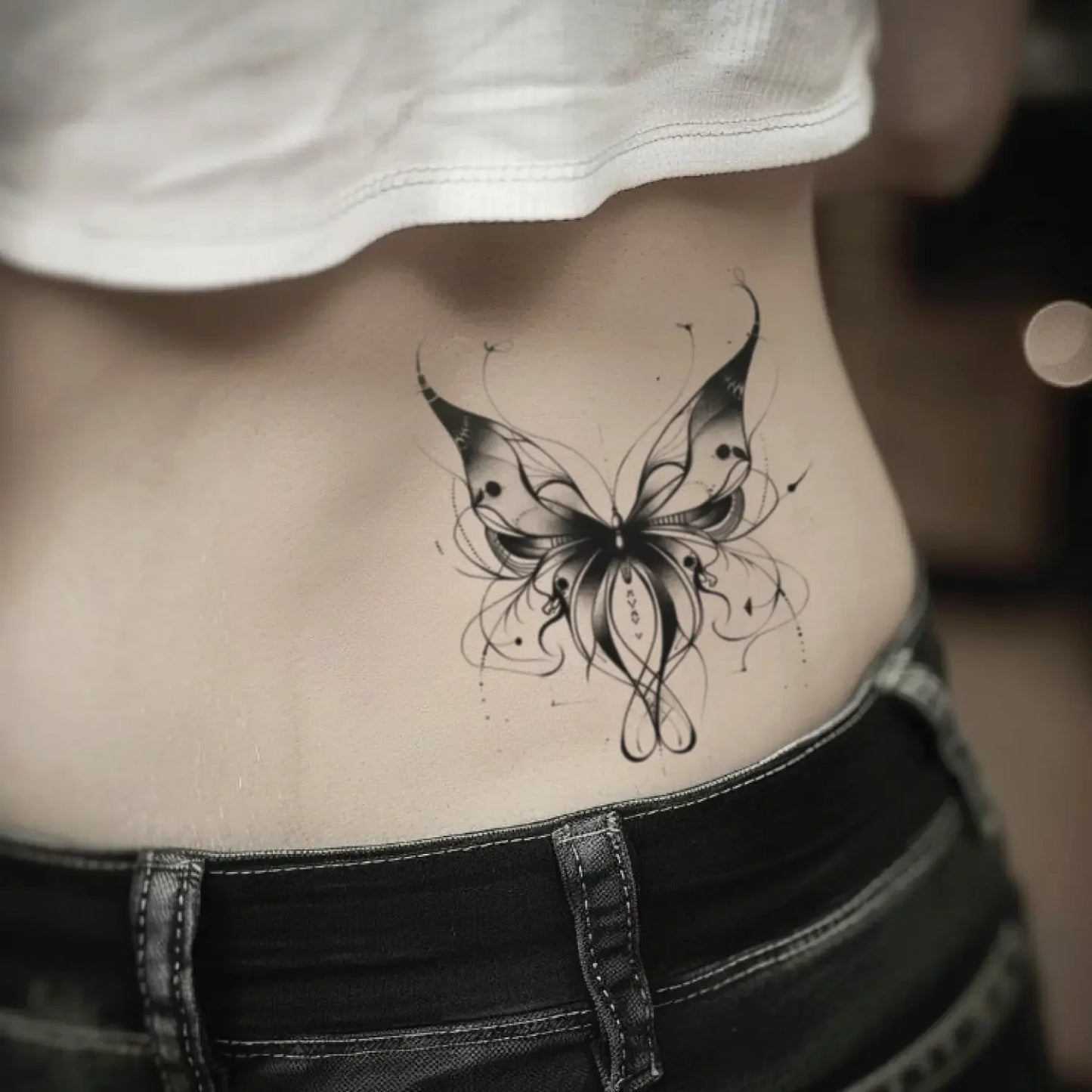 best cool simple small black white grey color abstract butterfly insect fake realistic temporary tattoo sticker design idea drawing for men and women on lower back