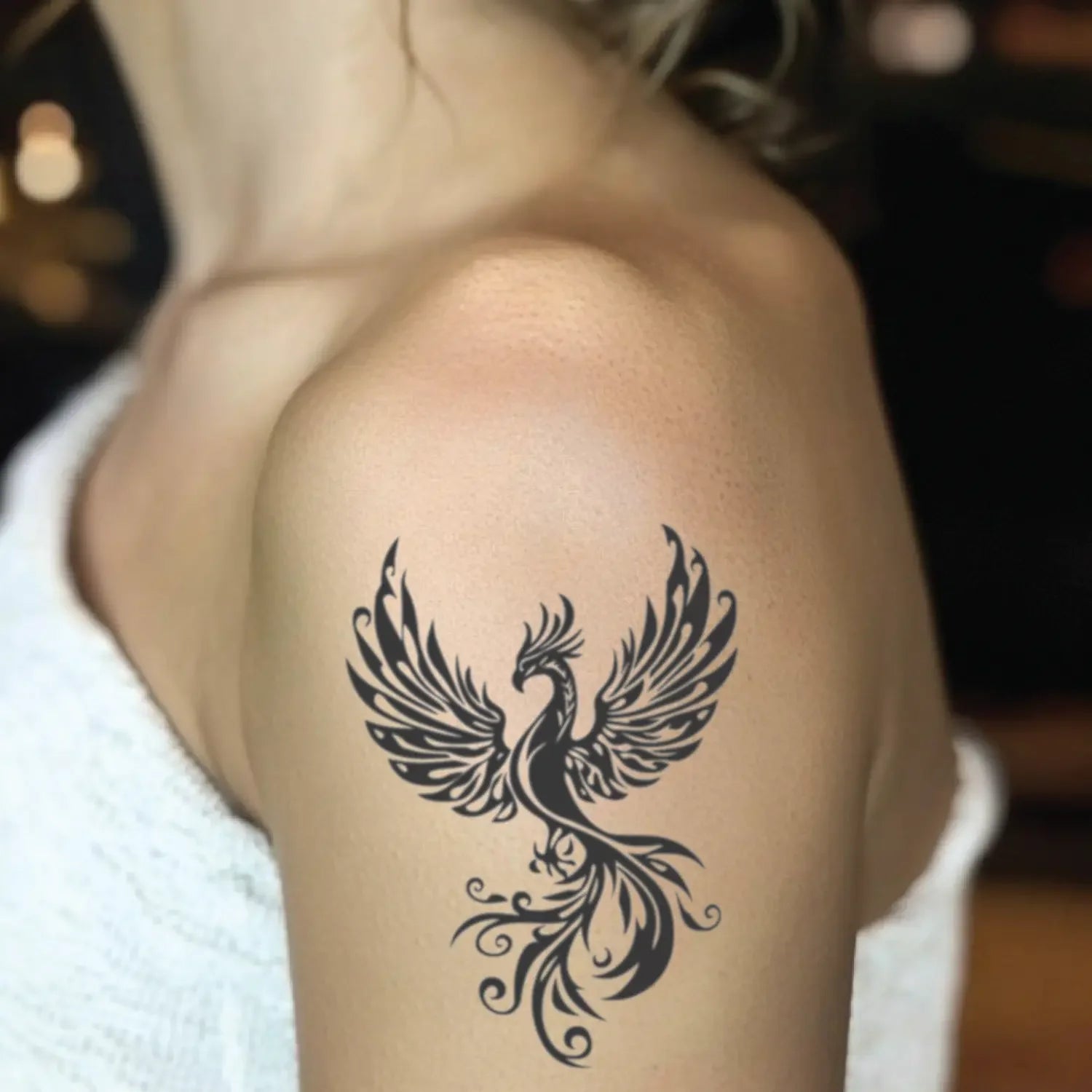 best cool simple small black white grey color tribal celtic phoenix mythological animal fake realistic temporary tattoo sticker design idea drawing for men and women on bicep upper arm