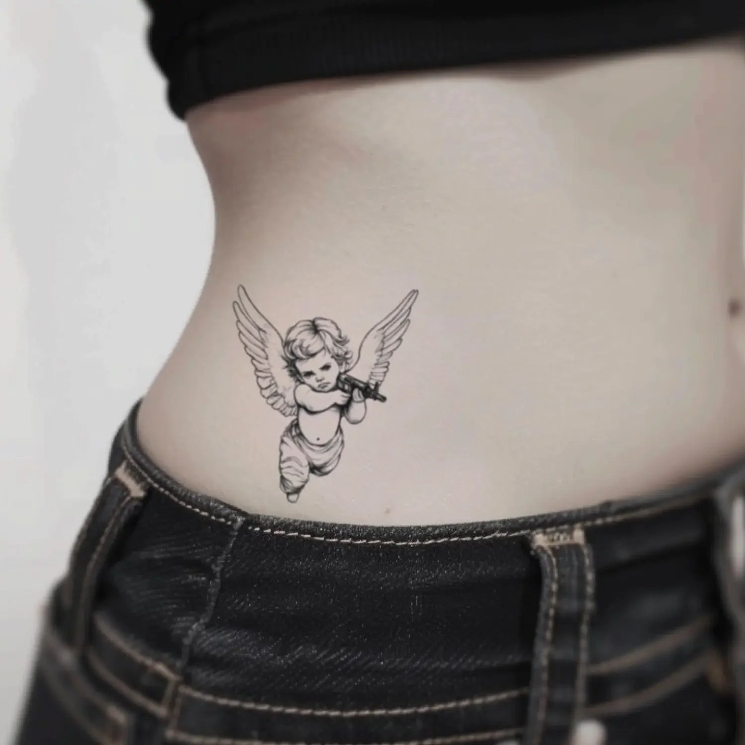 best cool simple small black white grey color Outline, Illustrative Cherub Angel Baby with AK47 Gun Religious fake temporary tattoo sticker design idea for men and women on Waist