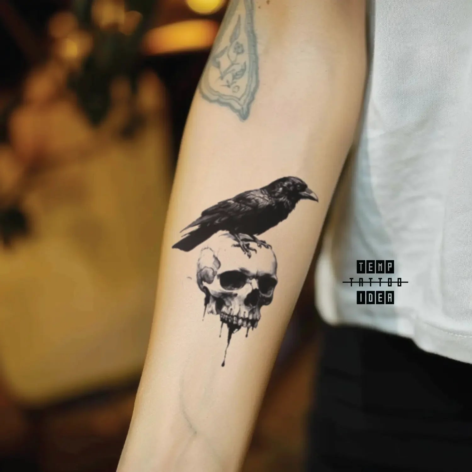 best cool simple small black white grey color gothic gothic crow on skull animal symbol fake temporary tattoo sticker design idea for men and women on forearm