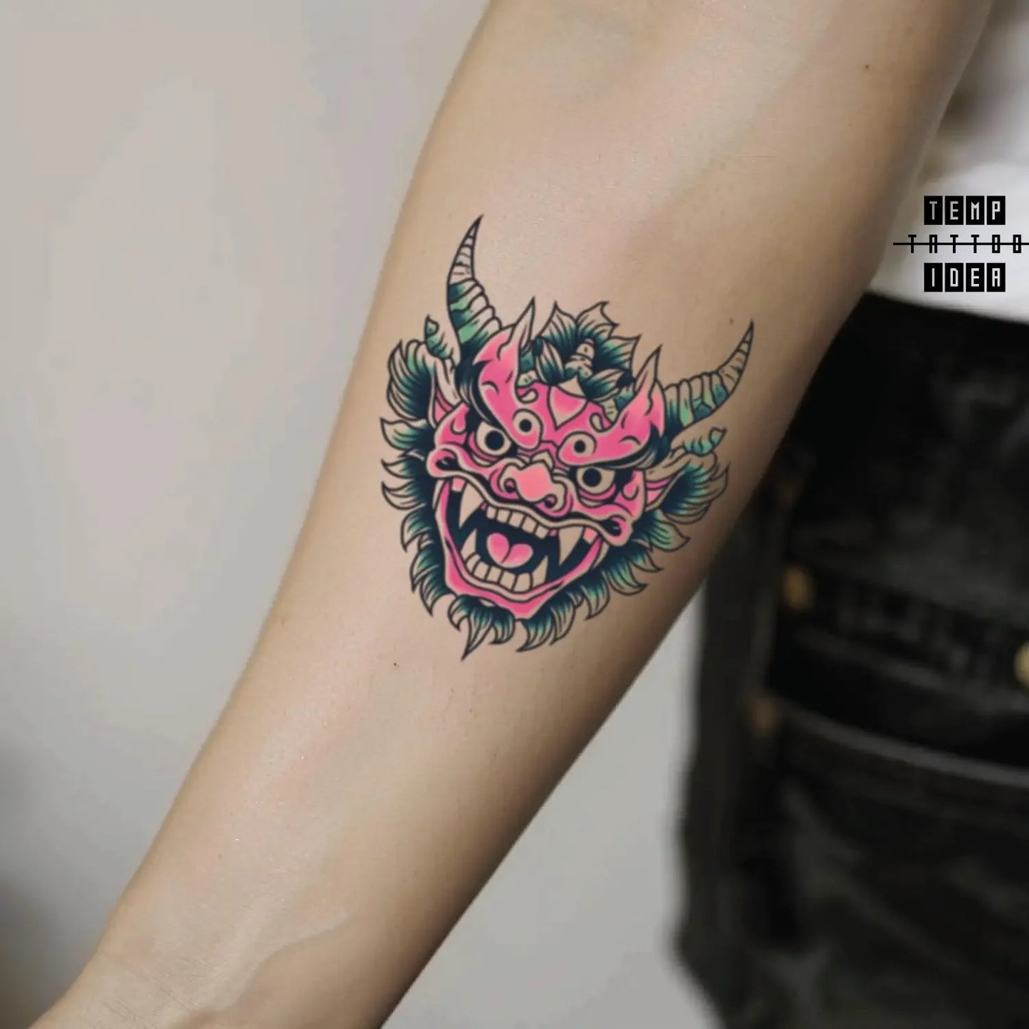 best cool simple small black white grey color pink green japanese japanese demon mythological symbol fake temporary tattoo sticker design idea for men and women on forearm